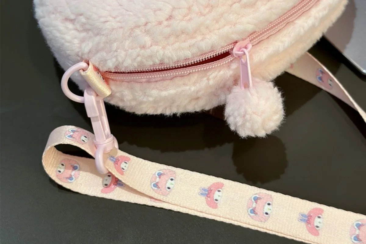 Plush backpack strap attachments